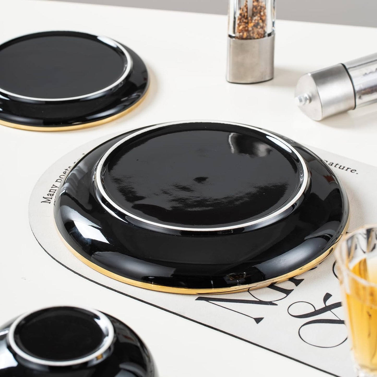 Black Ceramic Dinnerware Sets for 4, 16-Piece Contrast Plates and Bowls Set with Gold Rim, Crack Resistant | Dishwasher & Freezer Safe Dinnerware Set, Service for 4