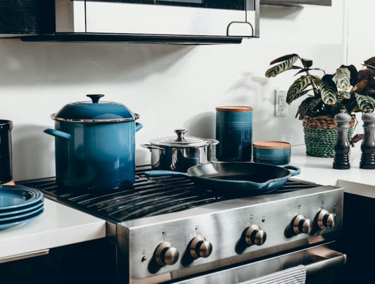 modern kitchen with nonstick cookware on stovetop