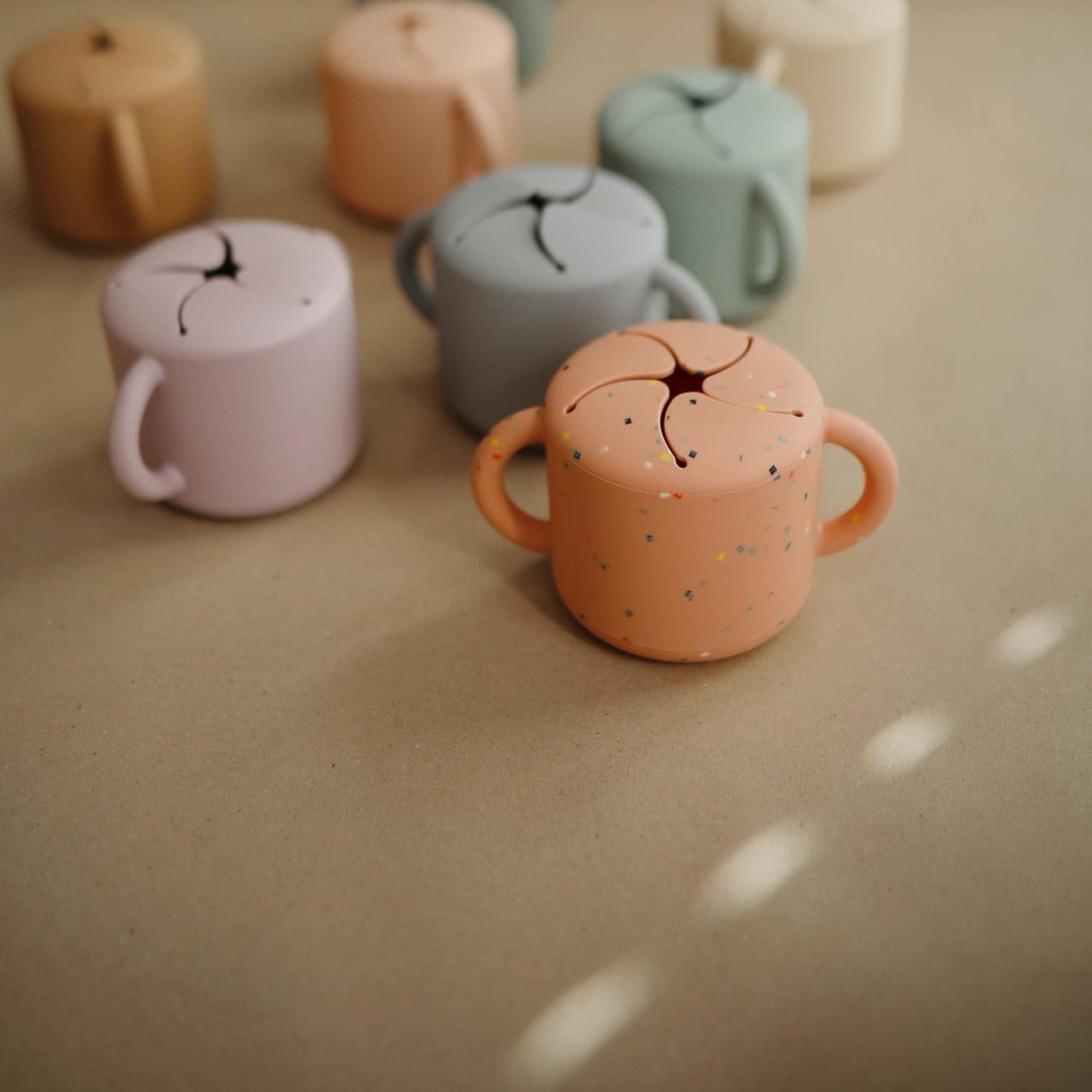 mushie Silicone Snack Cup | Spill Proof Food Container for Toddler and Baby (Powder Pink Confetti)