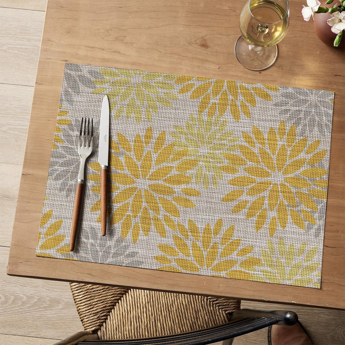 Artoid Mode Floral Plastic Placemats Set of 4, 12x18 Inch Washable Non-Slip Plastic Vinyl Place Mats for Party Kitchen Dining Decor, Yellow
