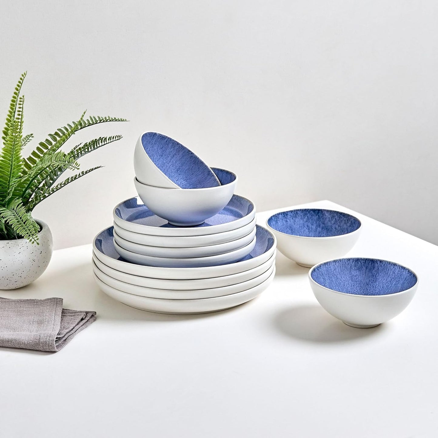Sango 12-Piece Stoneware Dinnerware Set for 4, Light Blue Reactive Glaze on White Plates and Bowls Sets, Kitchen Ceramic Dish Set, Modern Dishes for Everyday Dining, Microwave & Dishwasher Safe, Cove
